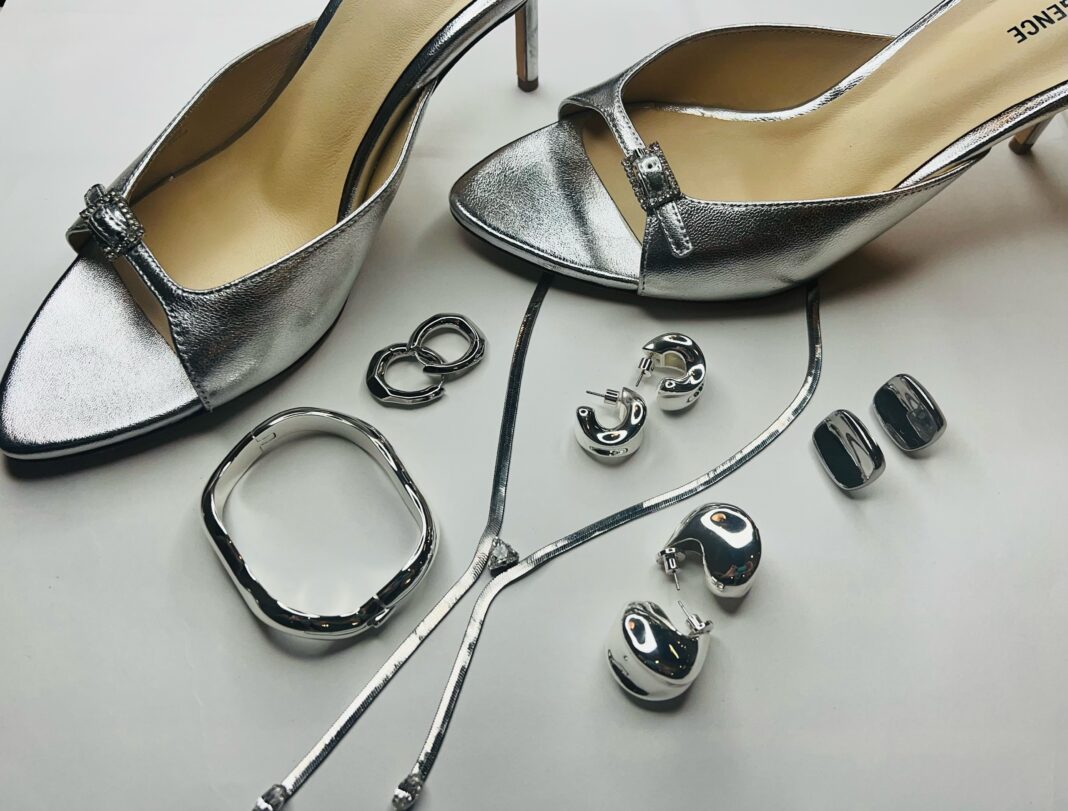 Silver is a sprint style staple this year seen in these silver slingback high heel shoes silver pendant earrings and long chain silver necklace with a silver bangle bracelet