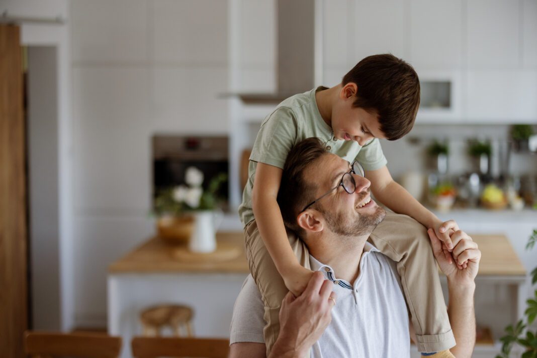 Family Fun: Happy Father and Son Engaged in a Funny Activity
